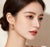 Material: 14K Rose Gold - elegant and durable Stones: Brilliant Round Diamonds - 0.2 carats per earring Style: Swirl Drop...