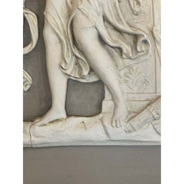 The 19th c. French Neoclassical Trumeau Mirror features Neoclassical images and a very fine patina, adding a touch of...