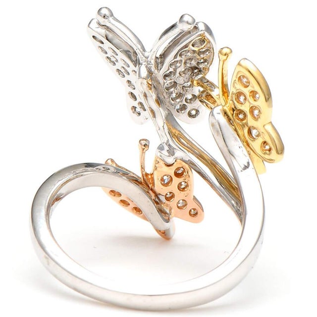 This charming 18k white gold ring setting comes with three darling butterflies that seamlessly connect. Sparkling diamonds...