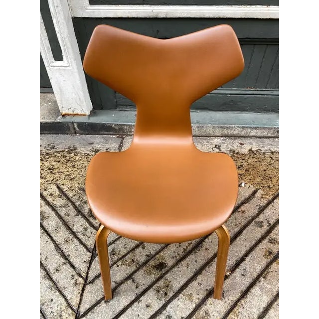 Arne Jacobsen Grand Prix Chair, model 4130. Original vinyl seat cover in very nice shape. Pretty clean example, spine in...