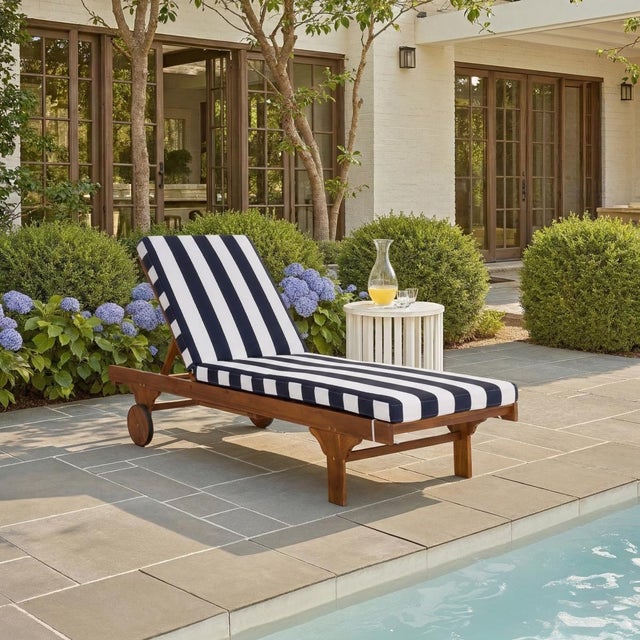 Transform your outdoor space with the Newport Lounge Chair in Navy Stripe. Featuring a chic natural and navy striped...