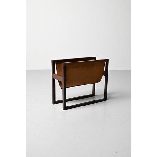 Danish rosewood magazine holder with suede. The joints of the frame are visible. This magazine holder is an example of...