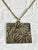 Vintage 1960s Coro pendant necklace featuring an oversized square philodendron leaf relief pendant with deeply textured...