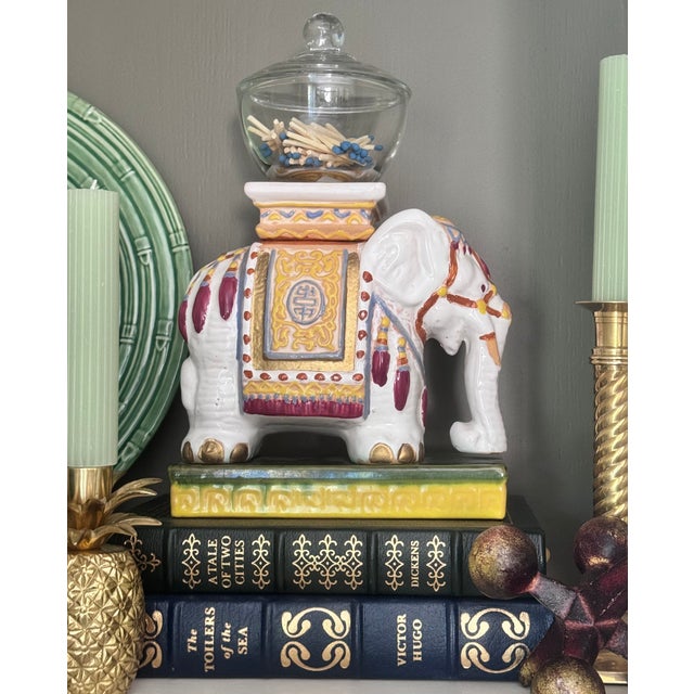 Add some vintage chic to your bookshelf or console table with this one-of-a-kind pair of hand painted ceramic Asian...