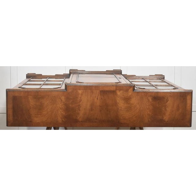 This refined breakfront bookcase showcases the warmth and character of beautifully figured walnut, crafted into a timeless...