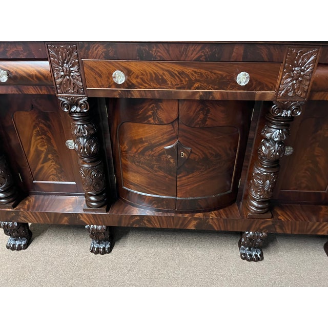 American Empire, circa 1830's American Empire Crotch Grain Mahogany Sideboard. This is the finest sideboard I have had the...