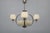 Striking 1930s art deco chandelier produced in czechoslovakia. The composition features nickel-plated metal framing a...