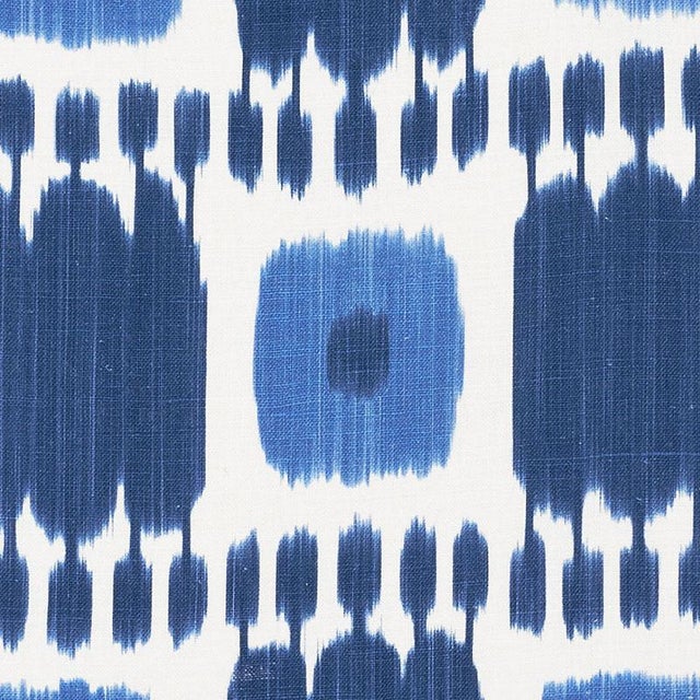 Kandira features a graphic pattern derived from woven ikats. A painterly checkerboard design with tonal variations and a...