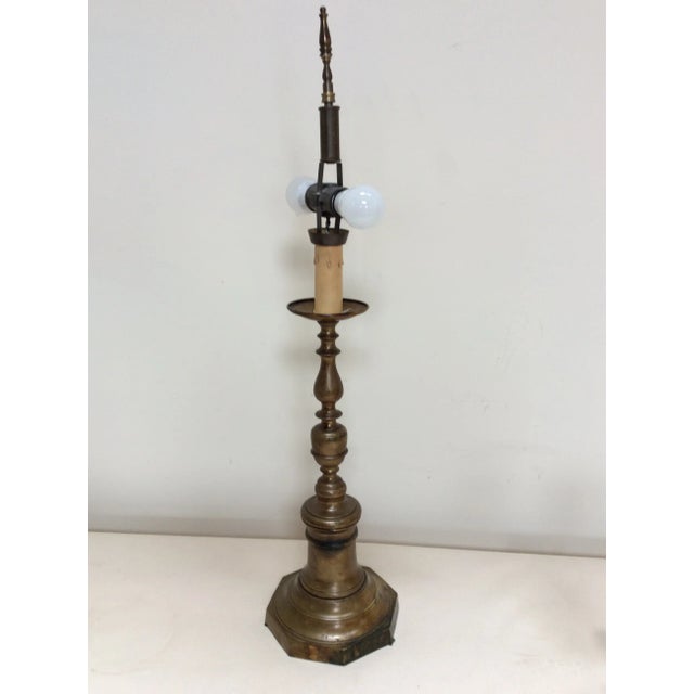 Offered is an antique bronze candlestick converted into a lamp in the early 20th century. Wonderful patina and classical...