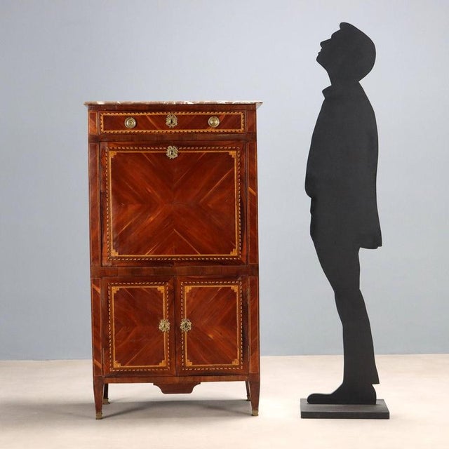 Fruitwood secretary. Maple, stained maple, and ebony trim, various wood frames. Front with under-counter drawer, central...