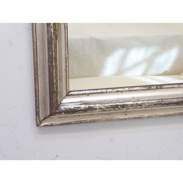 This silvered mirror has a generous 3.25" wide molding and strips of dark gray and bright silver finish. It measures...