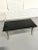 Use as a center hall table or a coffee table ideally suited for larger higher sofas/chairs. Made with polished 1/2" black...