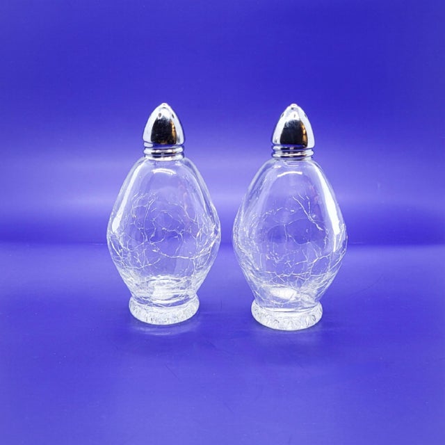Vintage Irice Japan crackle glass salt and pepper shakers bring a touch of Mid-Century elegance to any dining table. These...