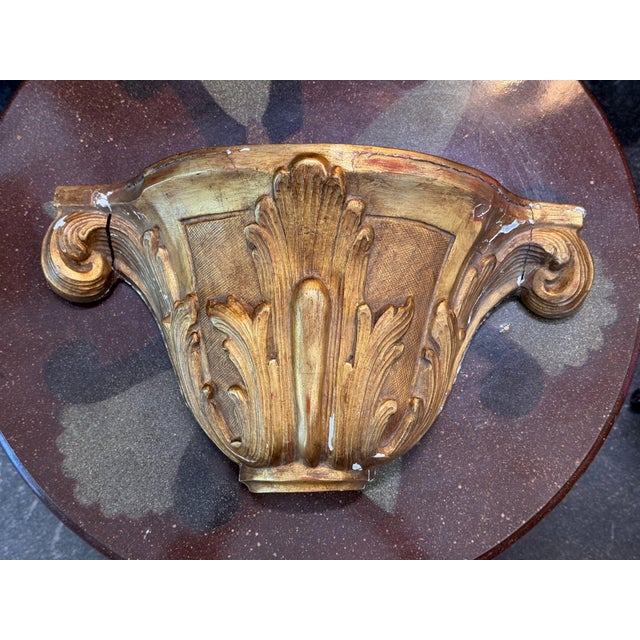 Carved Italian giltwood from the 19th century, with a shell and acanthus leaves across the front, scrolled ends and a...