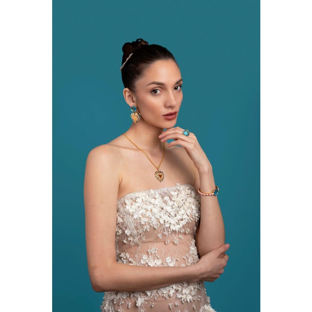 The Kathy Ring, adorned with a captivating blue quartz heart-shaped stone, encapsulates the essence of retro and vintage...