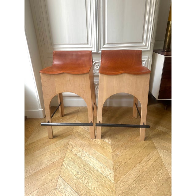 Pair of Jack counter stools by American design brand Lostine, handcrafted in Philadelphia. Featuring sculptural sycamore...