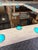 Rustic contemporary oak mirror featuring a grey wood frame accented with vibrant aqua dots. The clean rectangular shape...
