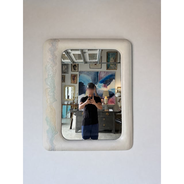 Striking vintage wall mirror by Lee Reynolds featuring a sculptural composite frame with softly rounded corners. One side...