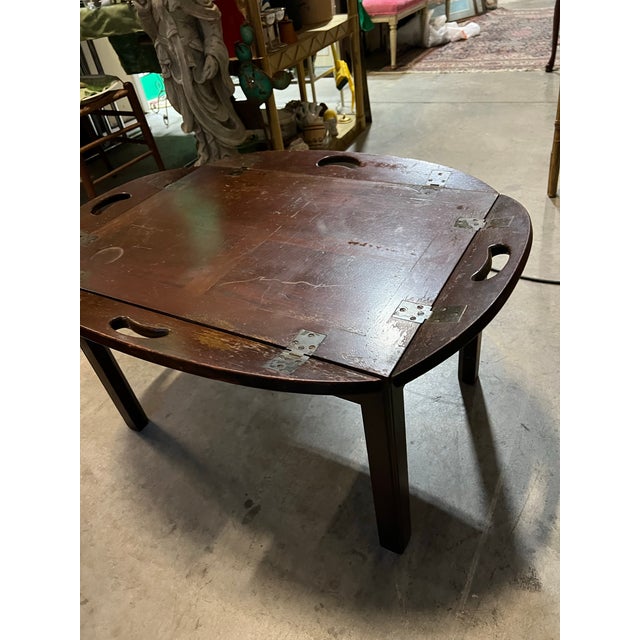 Up for consideration is a beautiful vintage wooden campaign style coffee table/tray table. This is a lovely accent piece...