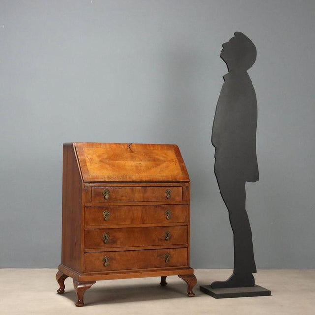 Small English mahogany bureau dating from the early 20th century, featuring a front with four drawers, the top one being...