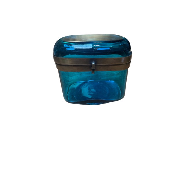 Beautiful blue Murano glass box with brass clasp and rim. Approx. 4.5” L x 3” D x 4.25” H