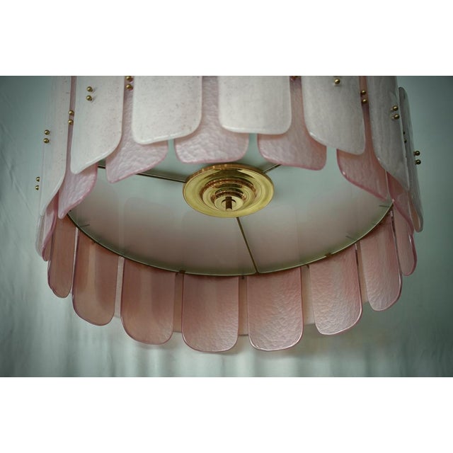 Fantastic round chandelier in Murano glass and polished brass. Note the shape of the pink Murano glass tiles, very...