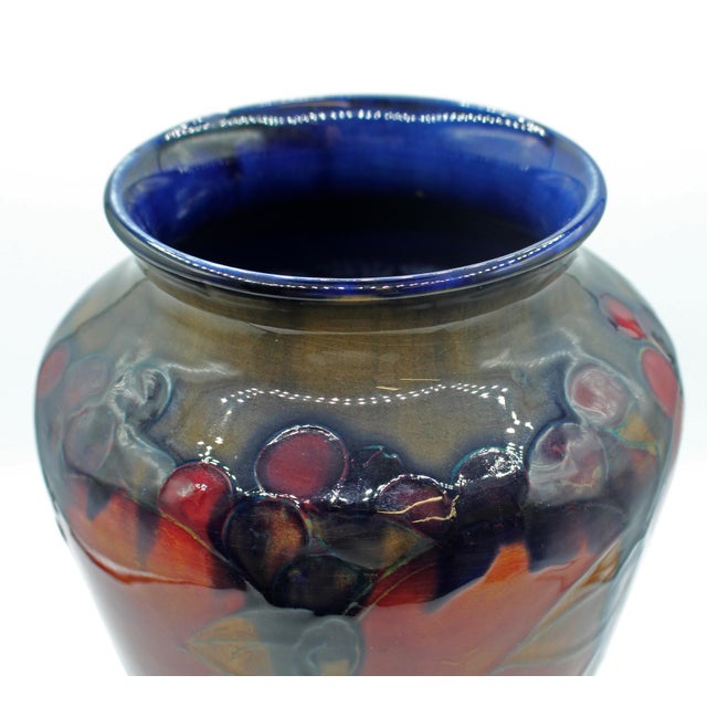 Pre-1928 William Moorcroft Vase in the "Pomegranate" pattern, England. Stunningly graceful, this monumental vase has a...