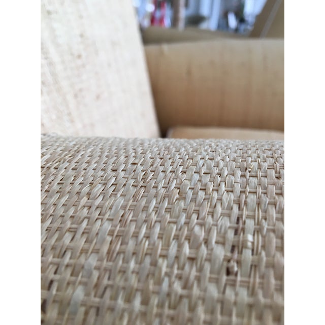 Pair of handsome raffia armchairs made in Italy. The chairs of custom cotton slip cover for a change of styles-- with a...