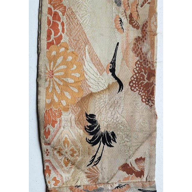 Japanese handmade silk Obi featuring Cranes in the design. Measuring 106" x 6.25' Age is unknown & estimated What cranes...