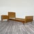 An exclusive 1950s bedroom set in quintessential Midcentury Modern style, consisting of a single bed frame and a matching...