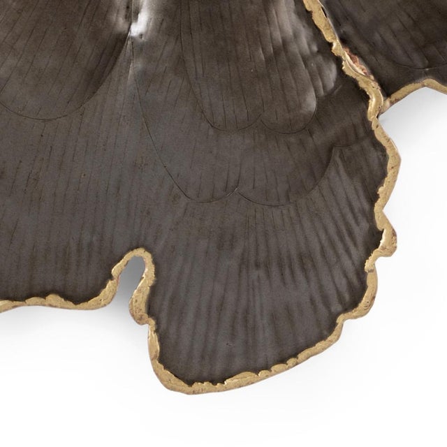 The lilliana mirror is formed as a leafy organic making the texture of each leaf the focal point. It is finished in an...