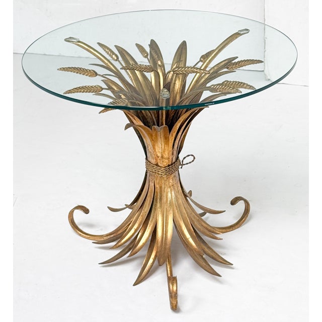 A fine Italian wheat sheaf cocktail or coffee table (or low table) from the Hollywood Regency era, featuring a round glass...