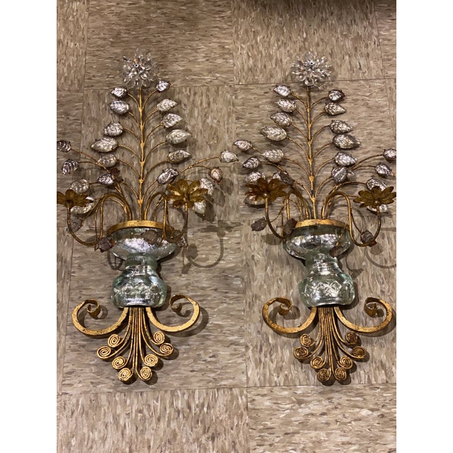 A pair of circa 1930’s French bagues gilt metal sconces with crystal vase and leaves, flowers design