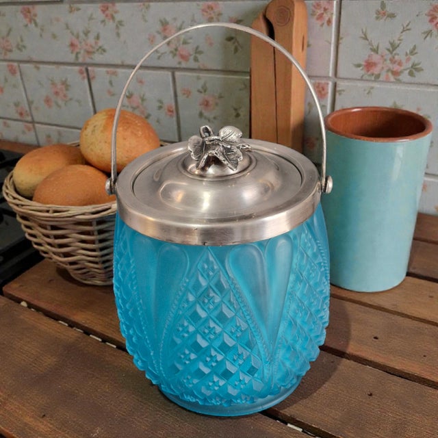 This Antique Victorian Blue Frosted Satin Glass Silver Plated Lid Handle Biscuit Jar is a charming collectible piece that...