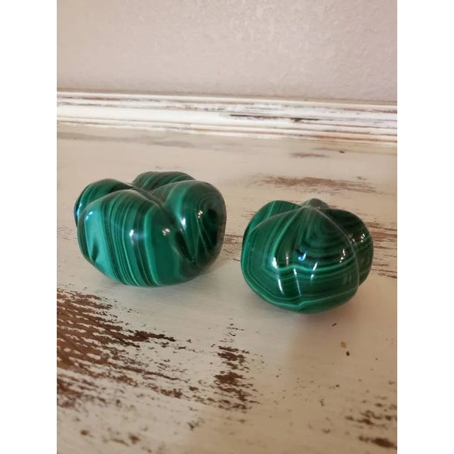A pair of beautiful, natural, solid,and substantial hand carved and polished bright green malachite in scalloped shaped...