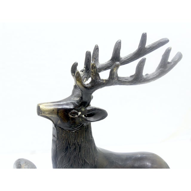 This prominent pair of sculptural stag bookends captures the quintessential rustic lodge aesthetic popular during the...