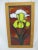 Bright and lovely stained glass window panel. A yellow Iris blooms against a sunset tone backdrop. Set in wood frame....
