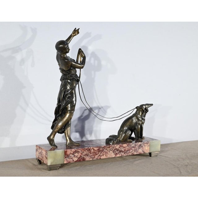 Regula subject depicting a lady walking her two greyhounds. with a bowl-shaped cut, slender silhouette and long dress...