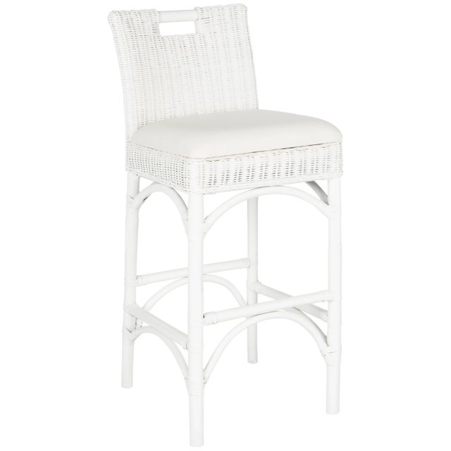 A transitional twist on Thonet styling, the white rattan barstool marries a contemporary seat back and a base with the...