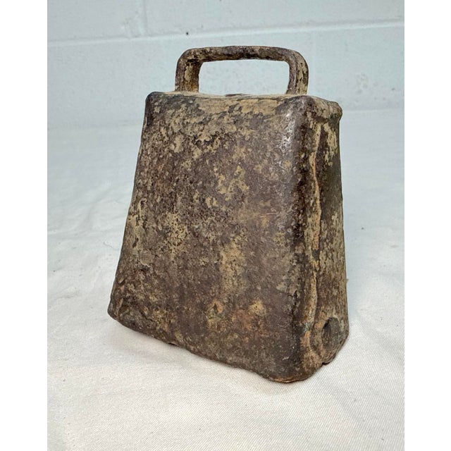 The early antique handmade 18th century wrought iron riveted calf bell is a unique and rustic decorative collectible....