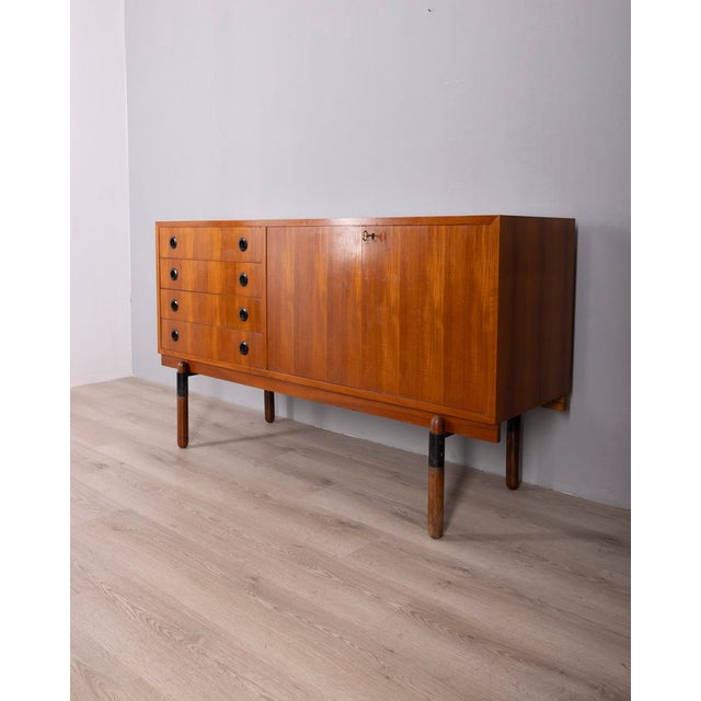 Teak wood sideboard with four drawers and two hinged doors with keys, Italian design, 1960s.