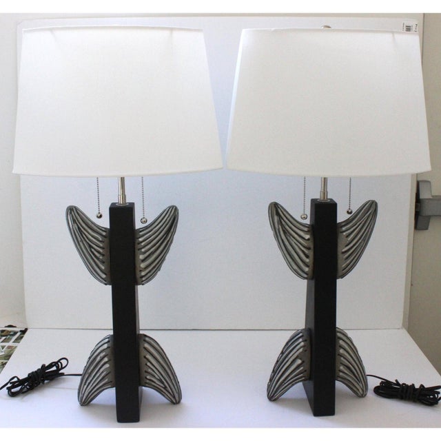 This stylish "totem form" pair of French table lamps date to the 1950s-1960s. Note: Shade dimensions are 12.50" top width...