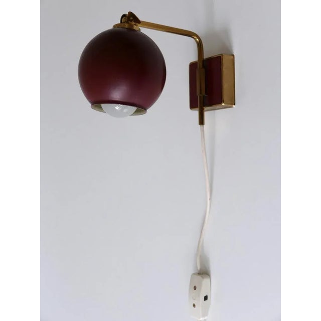 highly decorative Mid-Century Modern wall lamp or sconce. Designed & manufactured by Paul Neuhaus Leuchten, Germany,...