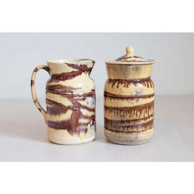 Two French pottery pitchers from the 19th century with cream and brown glaze, priced and sold individually $395 each....