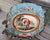 This great decorative pillow is upholstered in a finely woven wool and silk tapestry depicting a scene inspired by Les...