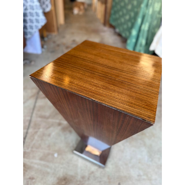 Beautiful and highly unique art deco side table. The base is polished chrome with a strip of copper trim. The top has been...