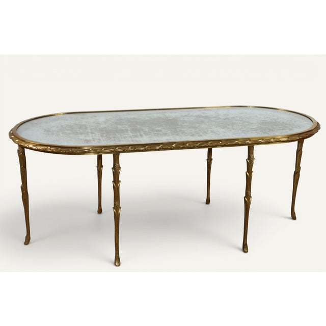 Elegant and refined, this oval coffee table, created by Maison Baguès in the 1950s, embodies the grand tradition of French...