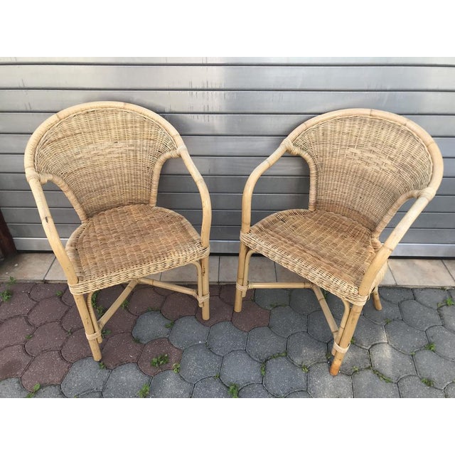 Rattan Bamboo Armchairs with Cushions, 70s, Set of 2 Set of 2 rattan-bamboo armchairs, 1970s The condition of the...