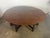 This handsome English gateleg dining table is crafted from richly grained oak and features a generous oval top supported...