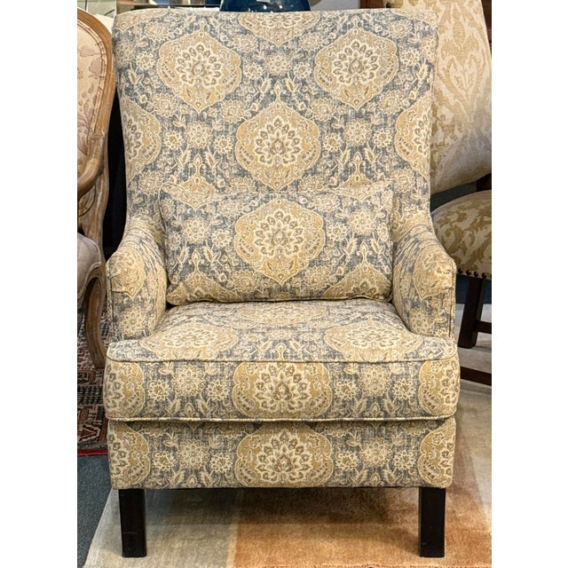 Design Plus Gallery presents the Aramore Accent Chair from Ashley Furniture. The chair has a dramatic scalloped high back,...